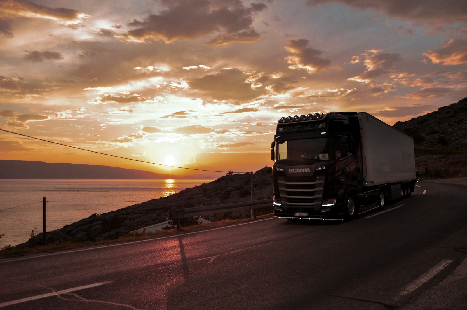 Scania long-haul cargo truck travelling on a highway